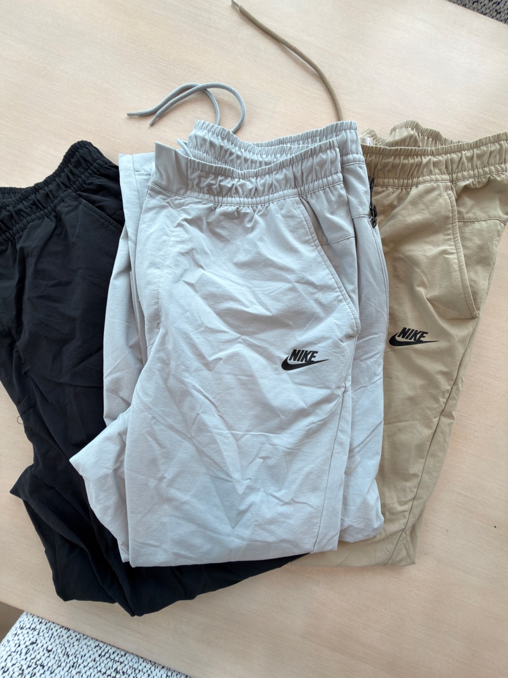 (3) Nike Men’s Athletic Drawstring Pants - Black, Light Gray, Tan